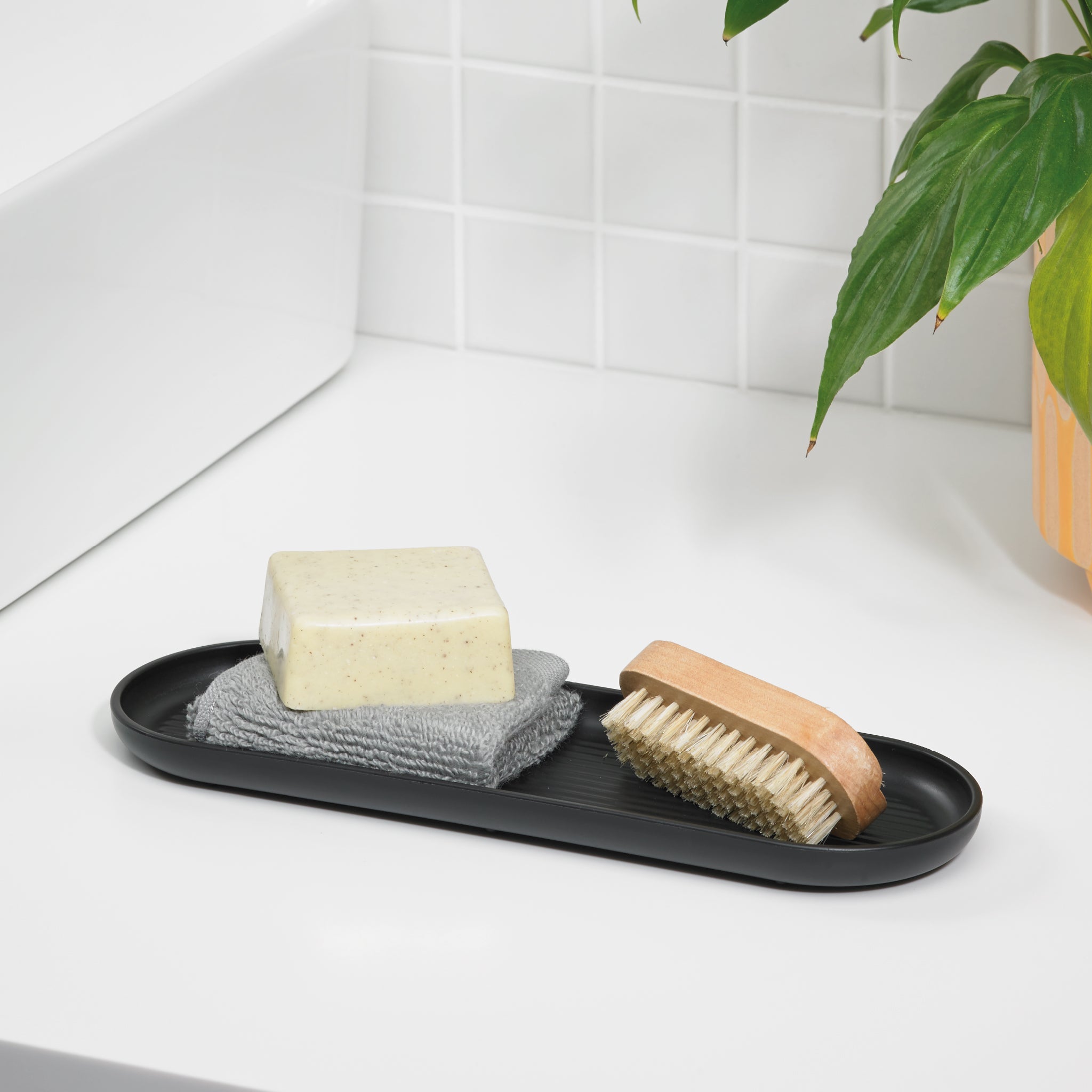 Sleek black bathroom tray by ReBorn, perfect for organizing toiletries with a modern touch.