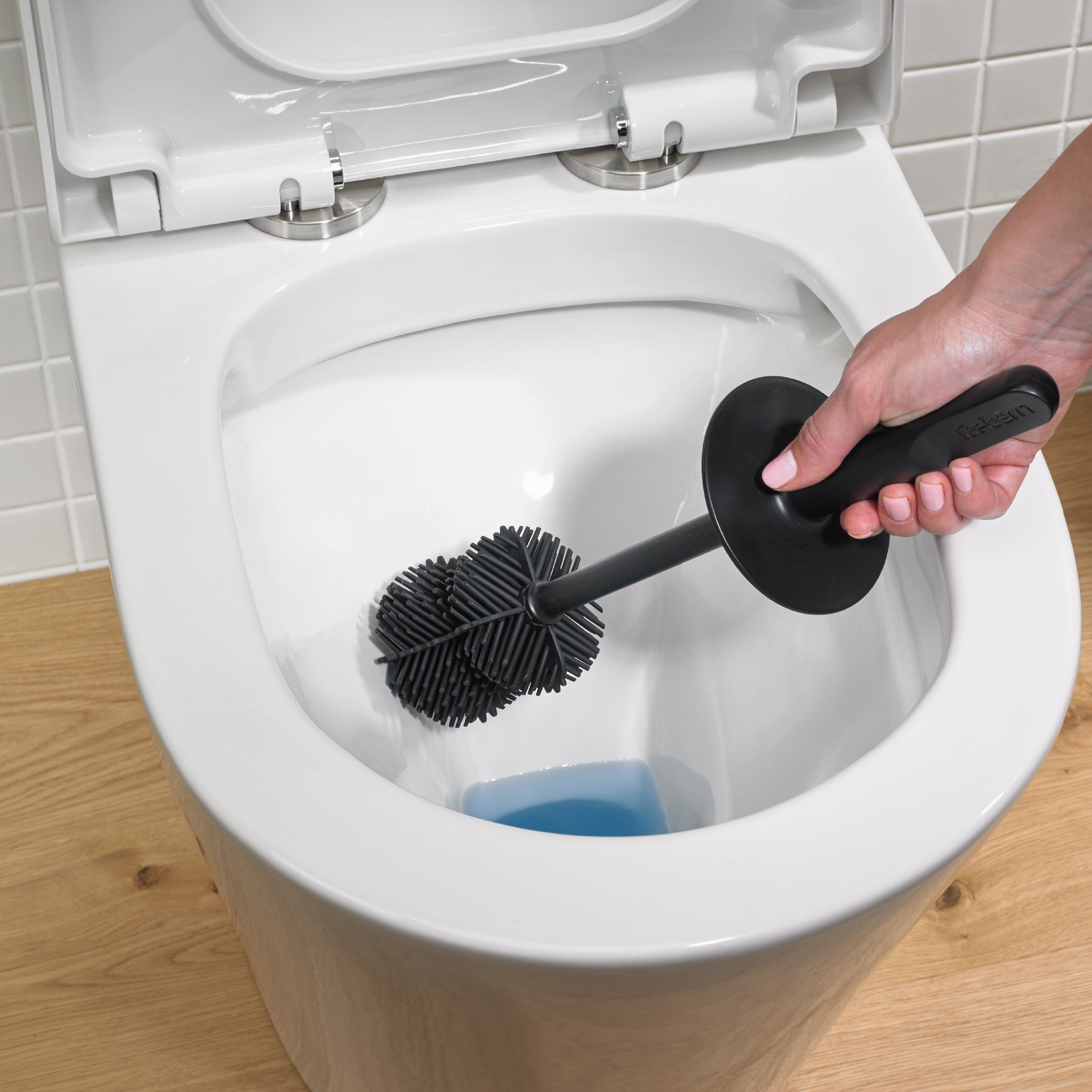 Flexible ReBorn toilet brush head with durable bristles for deep, scratch-free cleaning.