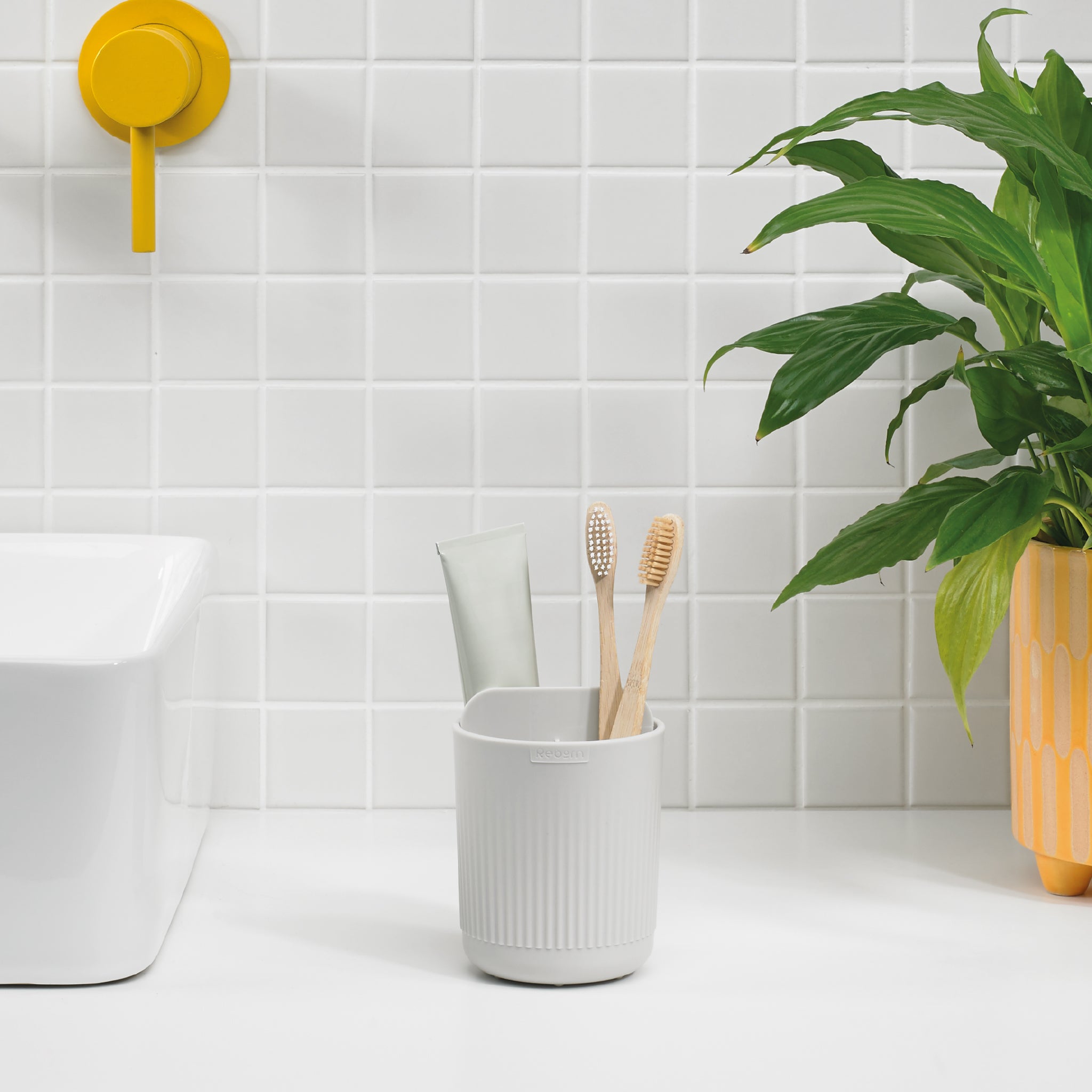 ReBorn white ribbed toothbrush holder, stylish and durable for organized, clutter-free countertops.