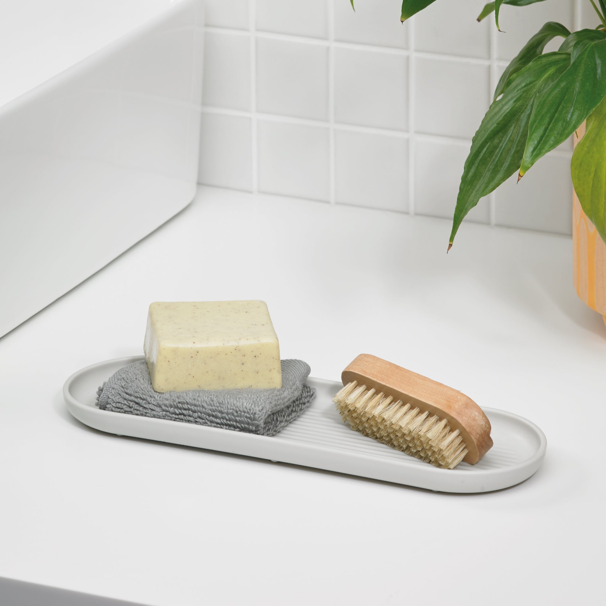 Minimalist bathroom tray keeps essentials organized—ideal for soaps, brushes, and a tidy countertop.