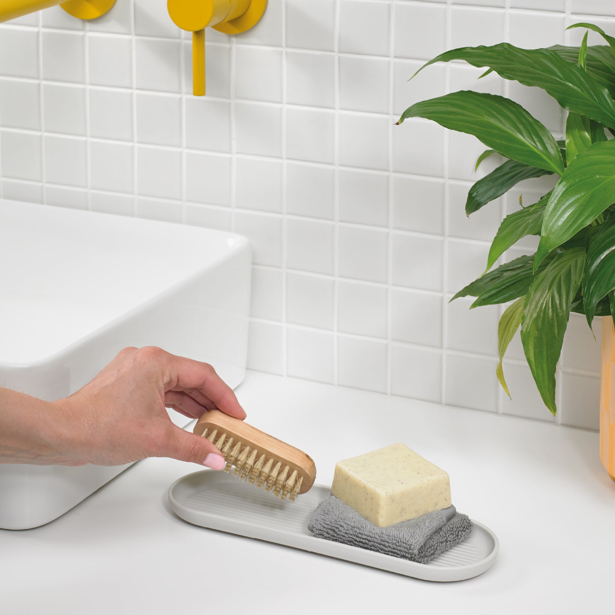 Sleek Graphite Black bathroom tray keeps essentials organized, featuring a modern, water-resistant design.