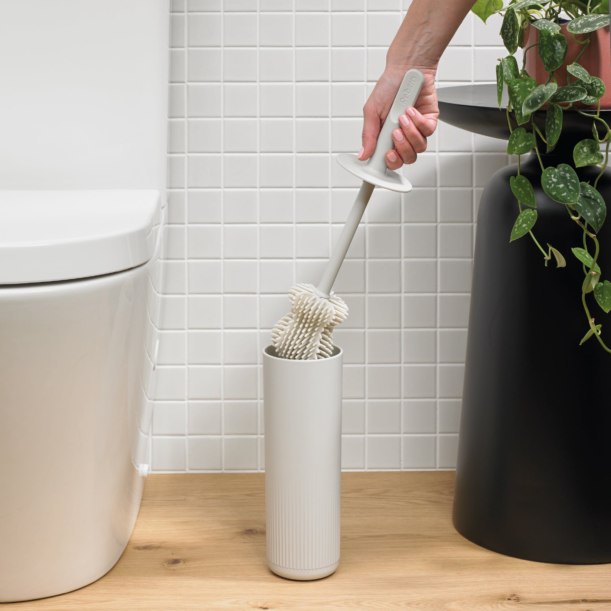 ReBorn toilet brush with a sleek holder, durable bristles, and a modern, space-saving design.