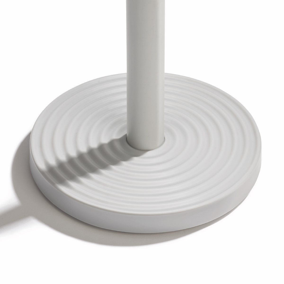 Eco-friendly kitchen roll holder with sturdy recycled materials and non-slip, textured base.