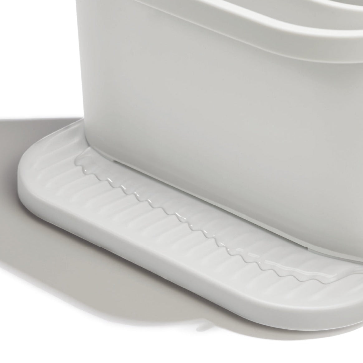 Recycled kitchen sink tidy with ridged drainage base, keeping sponges and brushes dry and organized.