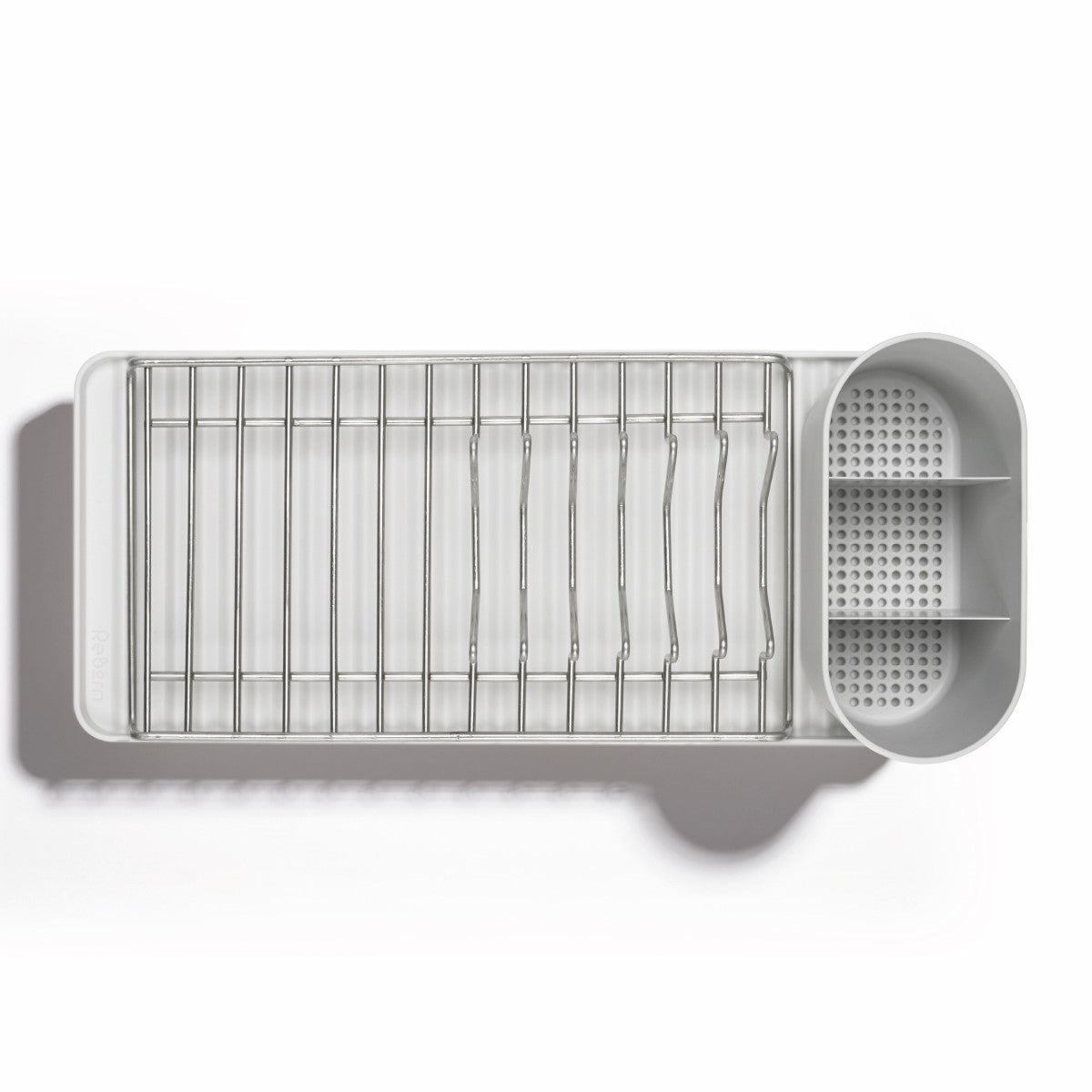 Compact recycled dish rack with metal grid, dual utensil compartments, and sleek, modern design for efficient drying.