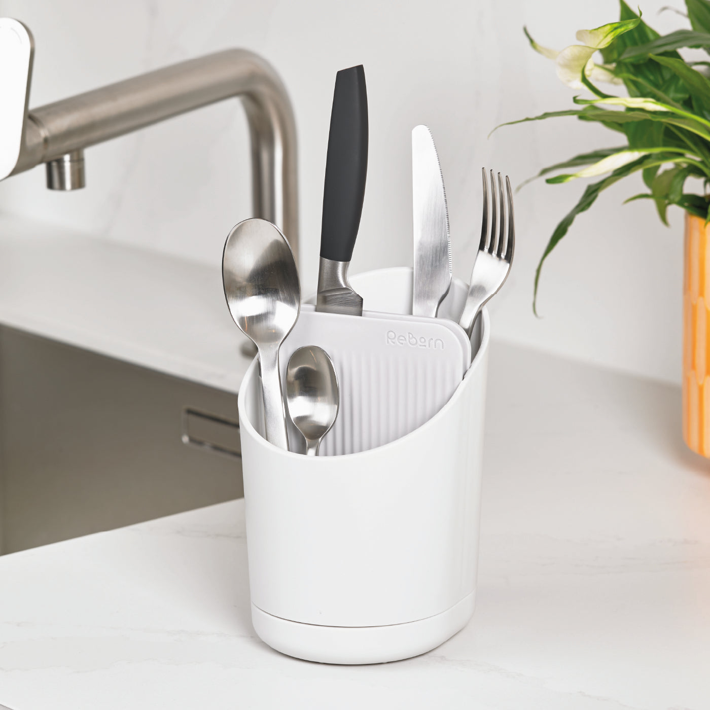 Eco-friendly recycled cutlery drainer, modern design for efficient drying and organized storage.