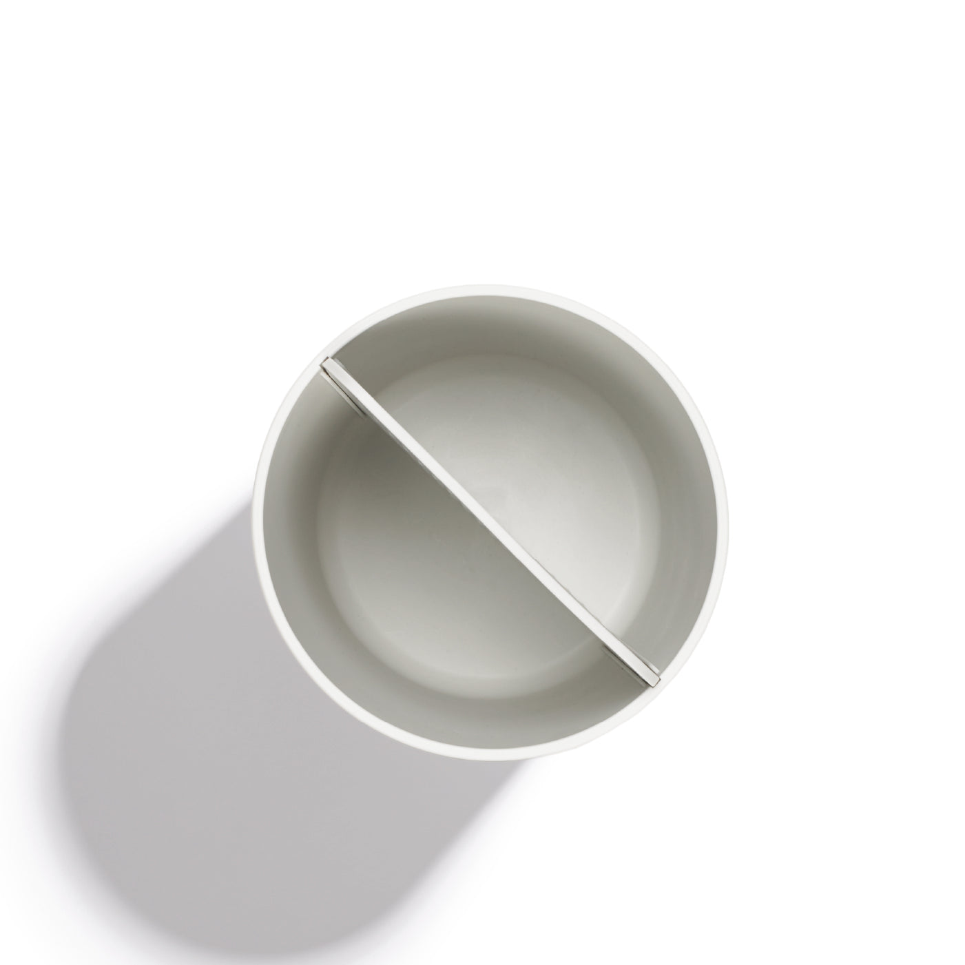 Modern recycled utensil holder, dual-compartment design for organized storage, sleek and eco-friendly.