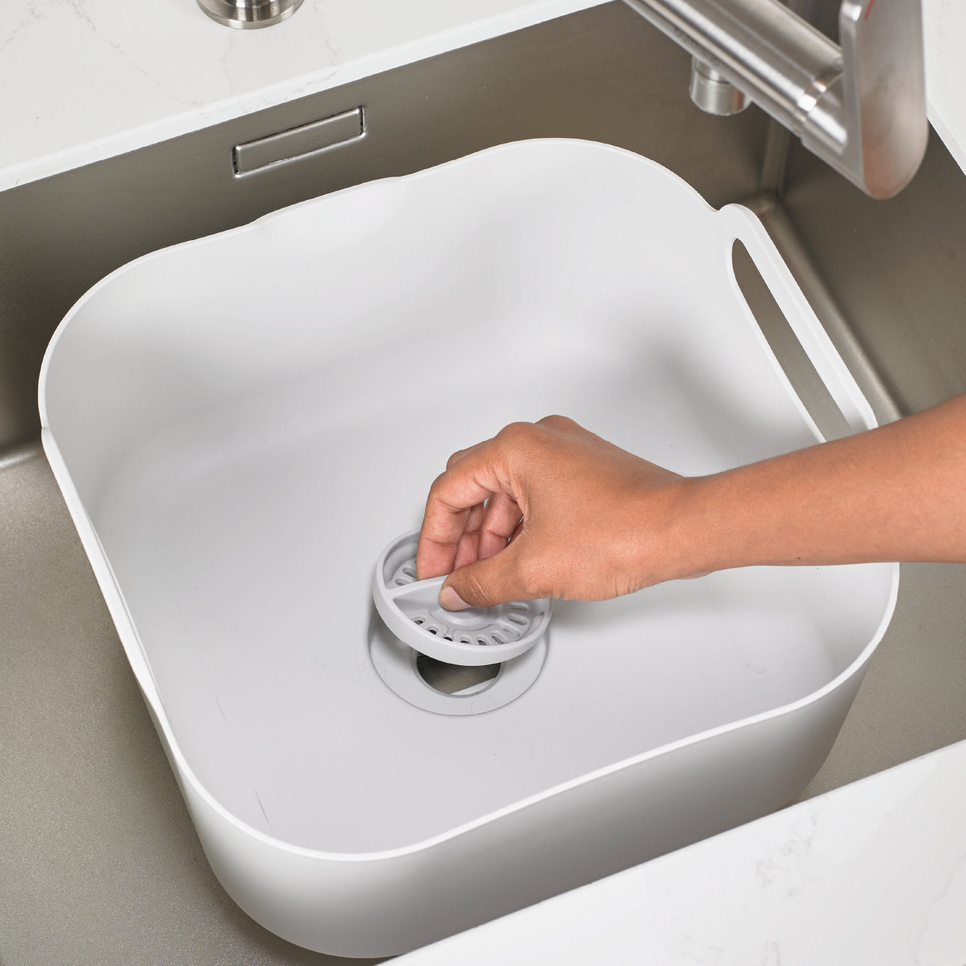 Eco-friendly recycled washing up bowl with built-in strainer, easy-lift handle, and space-saving design.