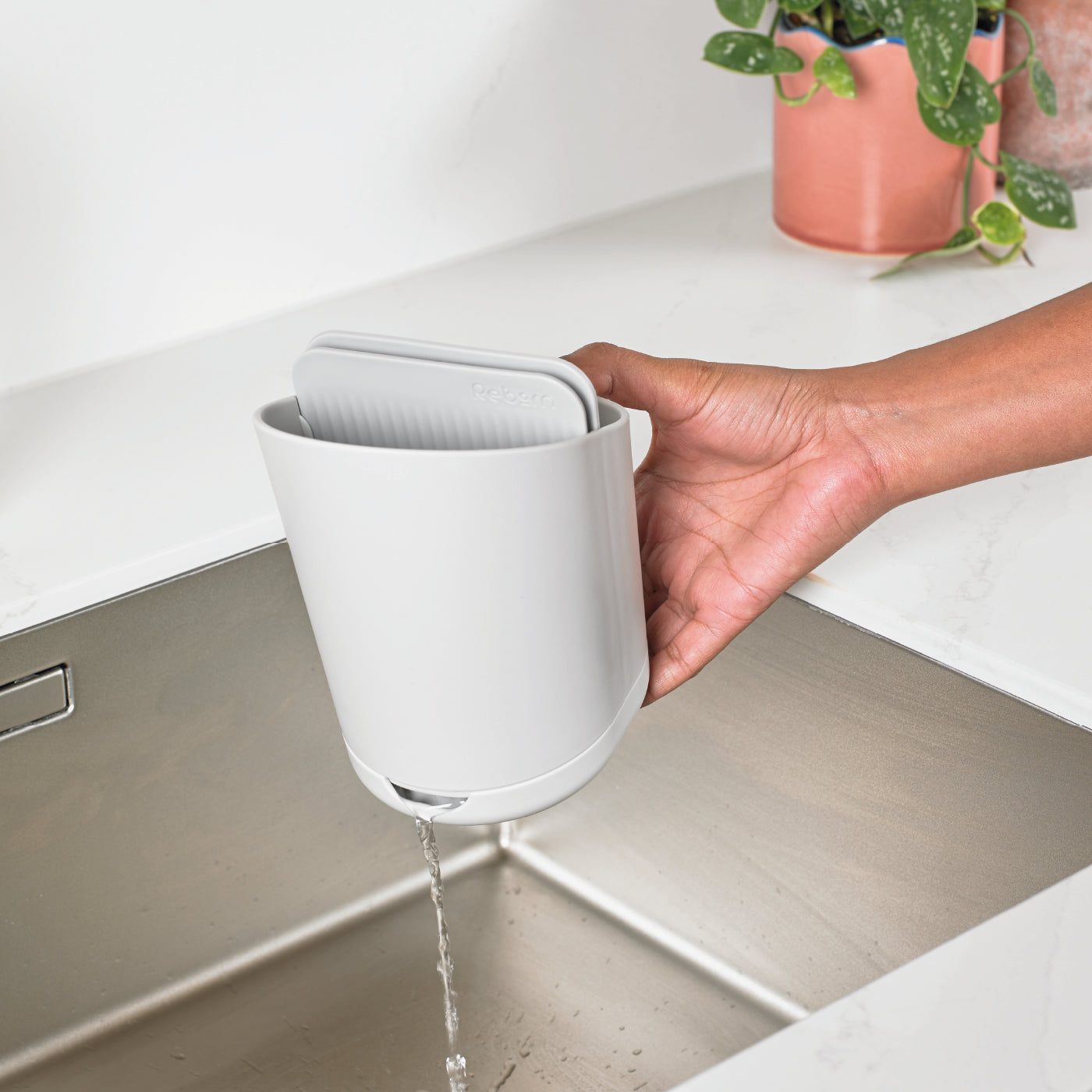 White recycled cutlery drainer with self-draining base, eco-friendly design, and modern aesthetic.