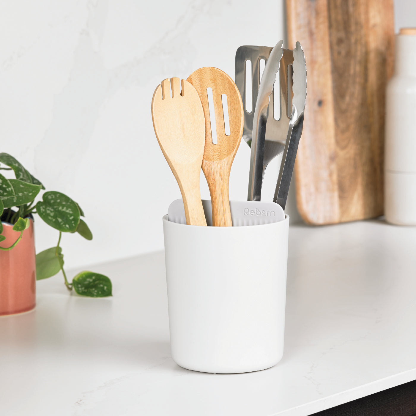 Recycled white utensil holder keeps kitchen tools organized sustainably—perfect for modern, eco-friendly spaces.