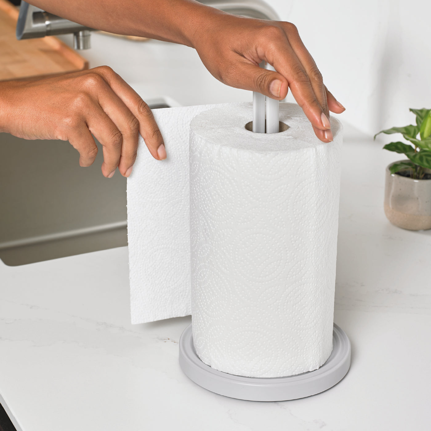 Eco-friendly kitchen roll holder with a sturdy recycled base for stable, one-handed tearing.