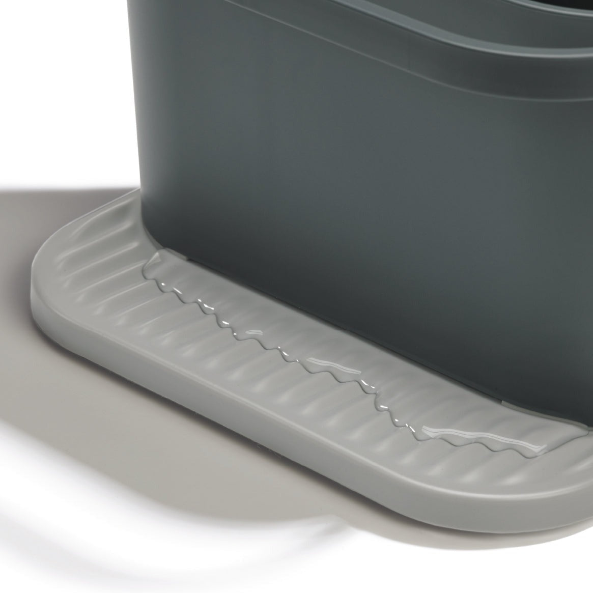 Eco-friendly sink tidy made from recycled materials, with drainage grooves for a cleaner, organized kitchen.