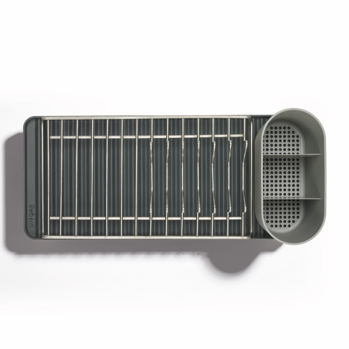 Compact recycled dish rack with utensil holder, perfect for small kitchens and eco-friendly homes.