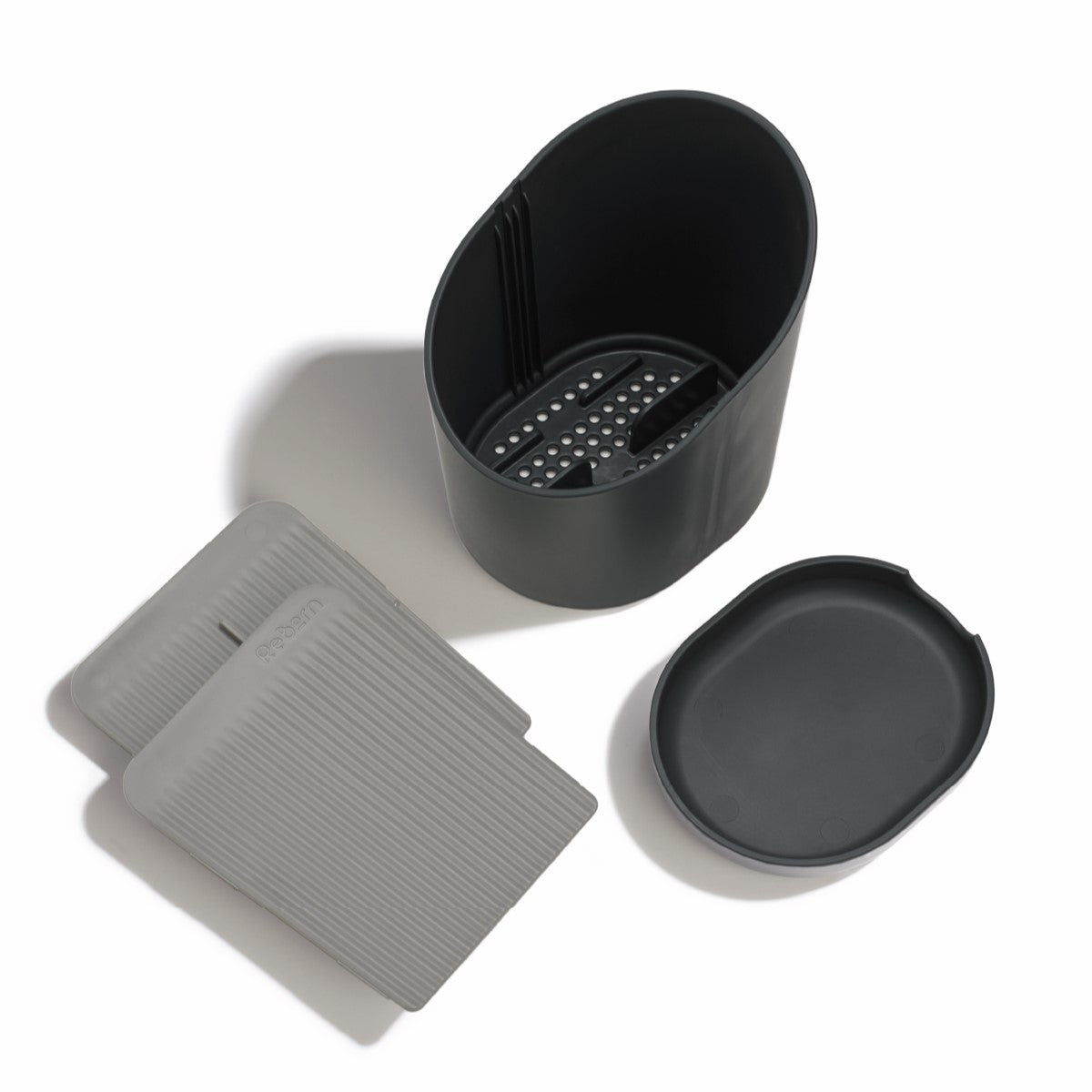 Recycled cutlery drainer with detachable parts, efficient drainage, and modern design for organized drying.