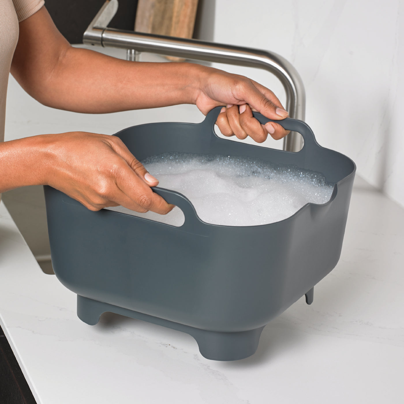 Dark gray recycled washing up bowl with sturdy handles and raised feet for easy drainage.