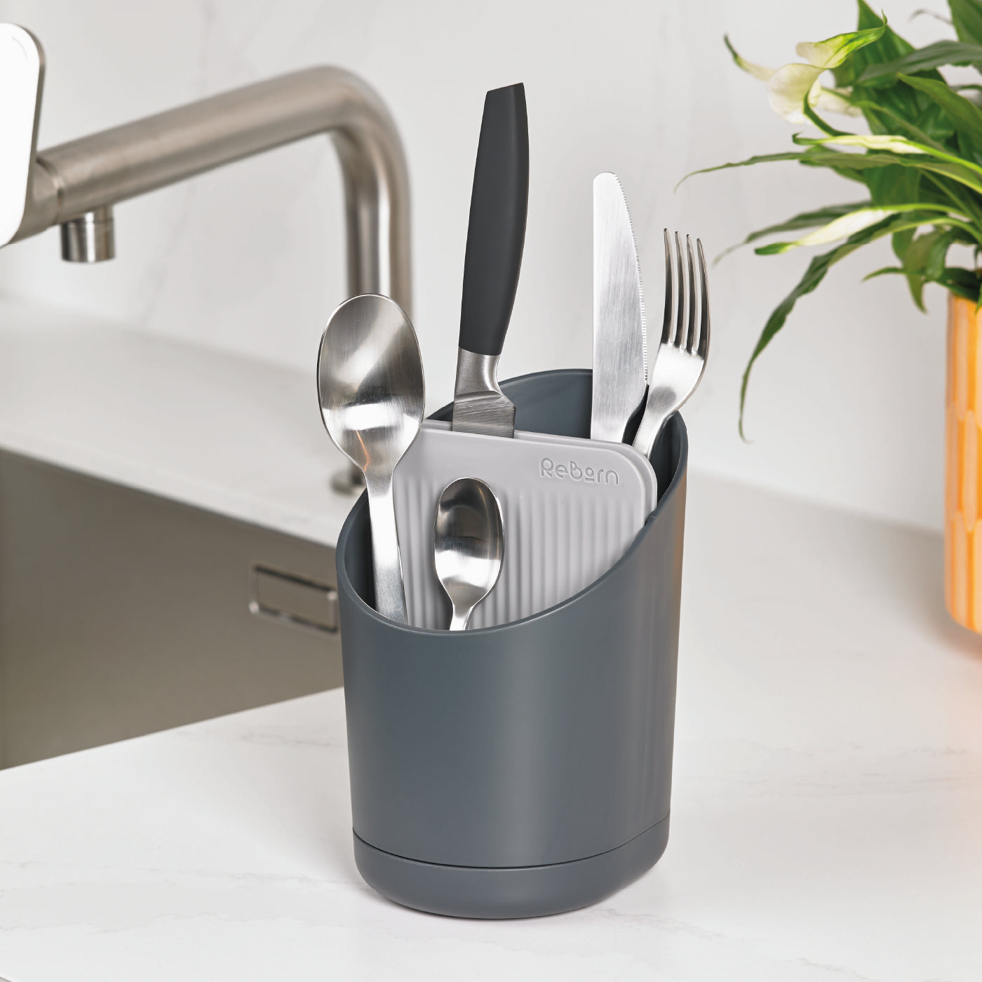 Recycled cutlery drainer in dark gray, sleek and eco-friendly for organized kitchen counters.
