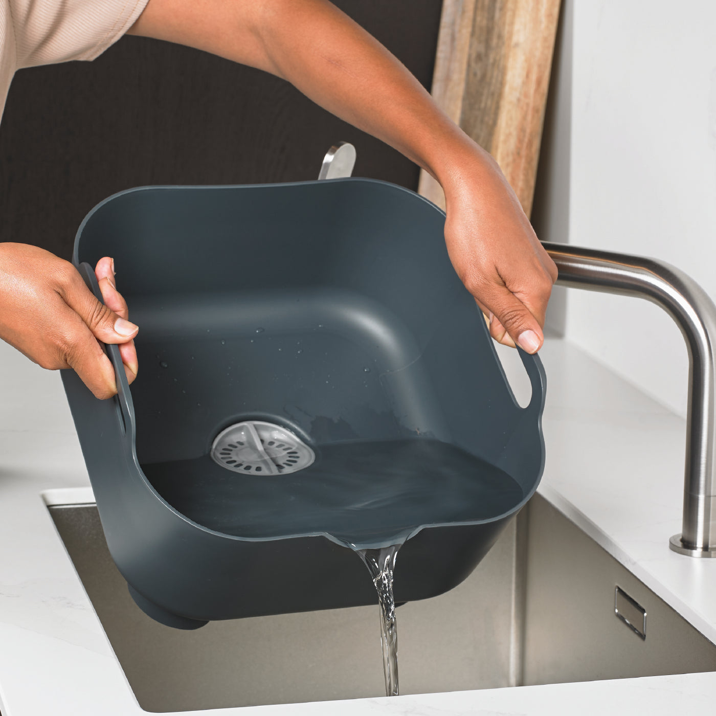 Recycled washing up bowl with built-in handles for easy pouring—eco-friendly and durable design.