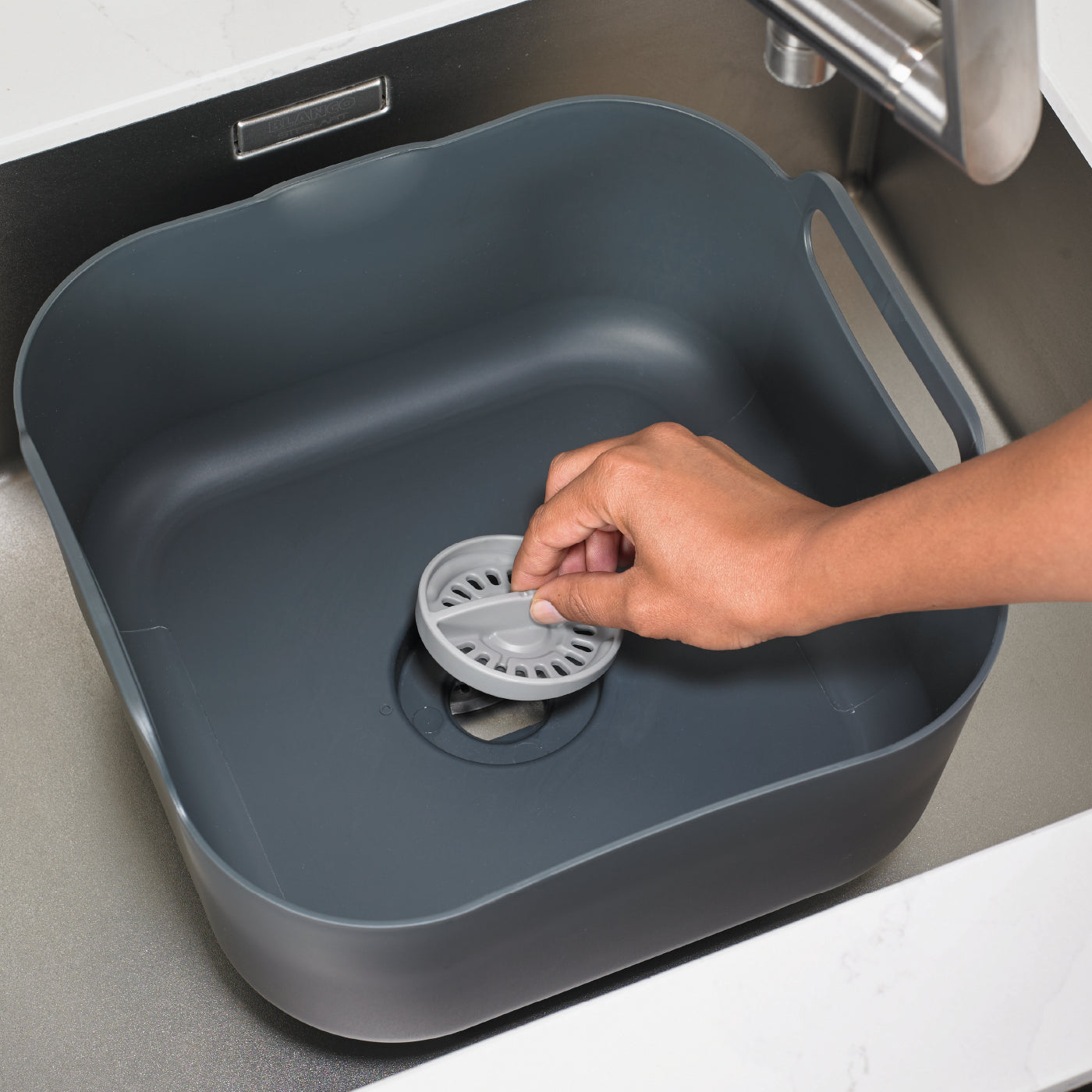 Dark grey recycled washing up bowl with side handles and built-in strainer for easy draining.