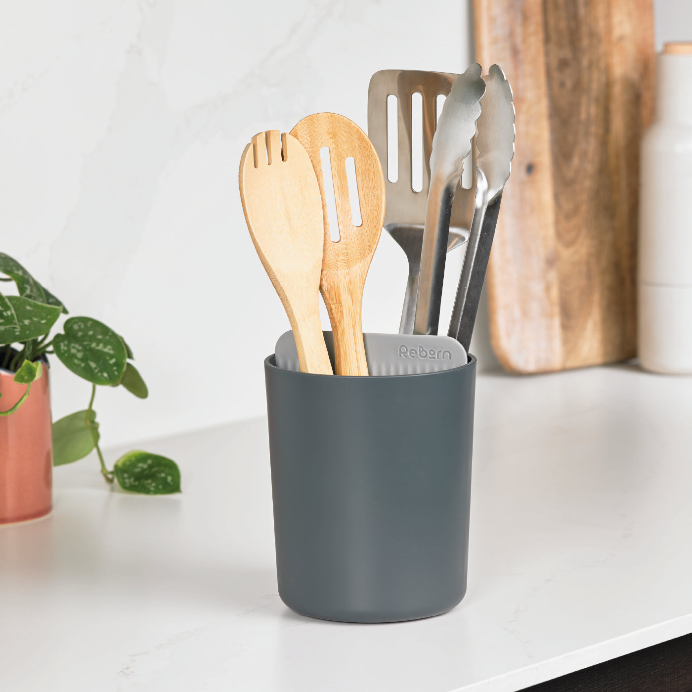ReBorn recycled utensil holder, eco-friendly and durable, keeps kitchen tools organized and accessible.