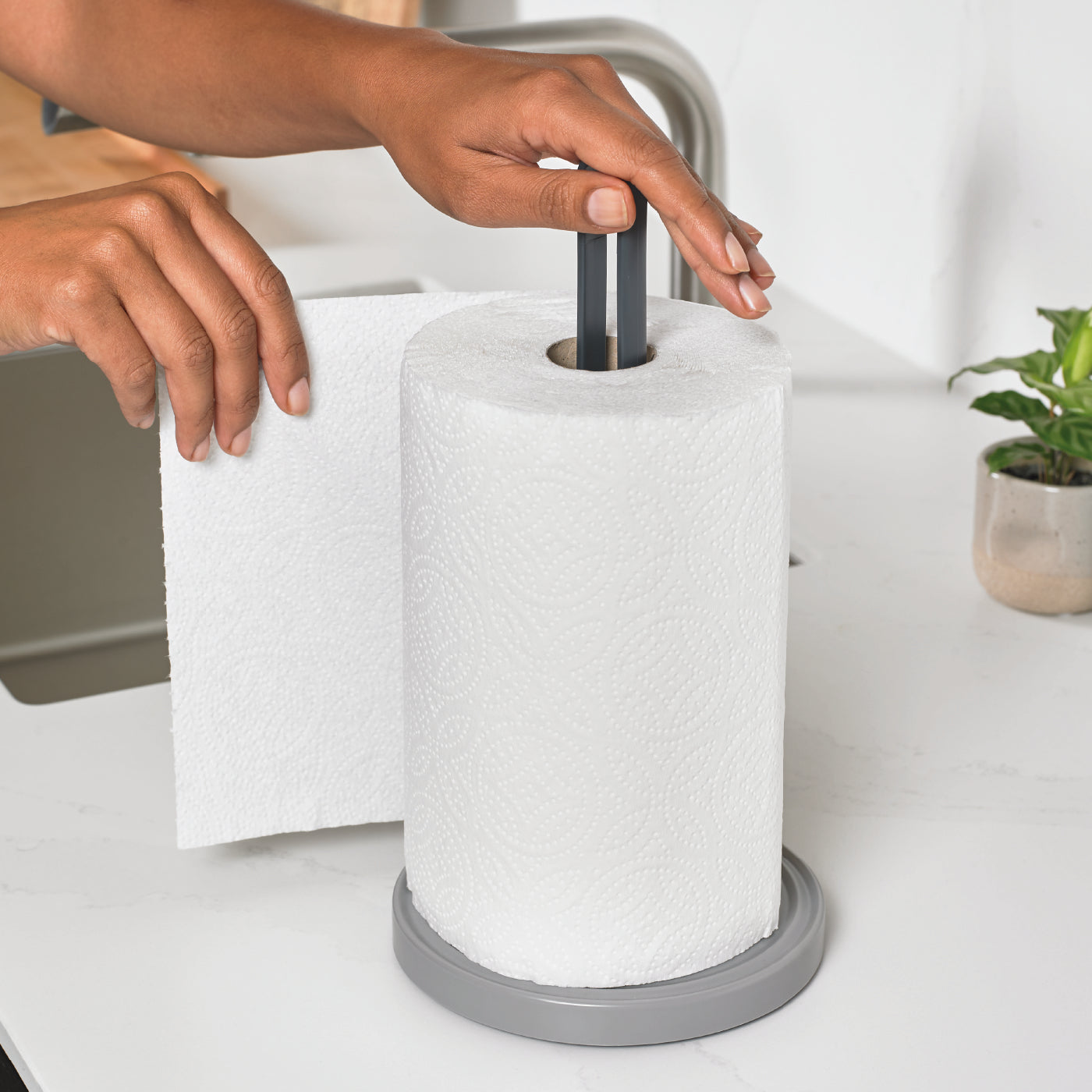 Eco-friendly recycled kitchen roll holder with a sturdy base for easy, one-handed use.