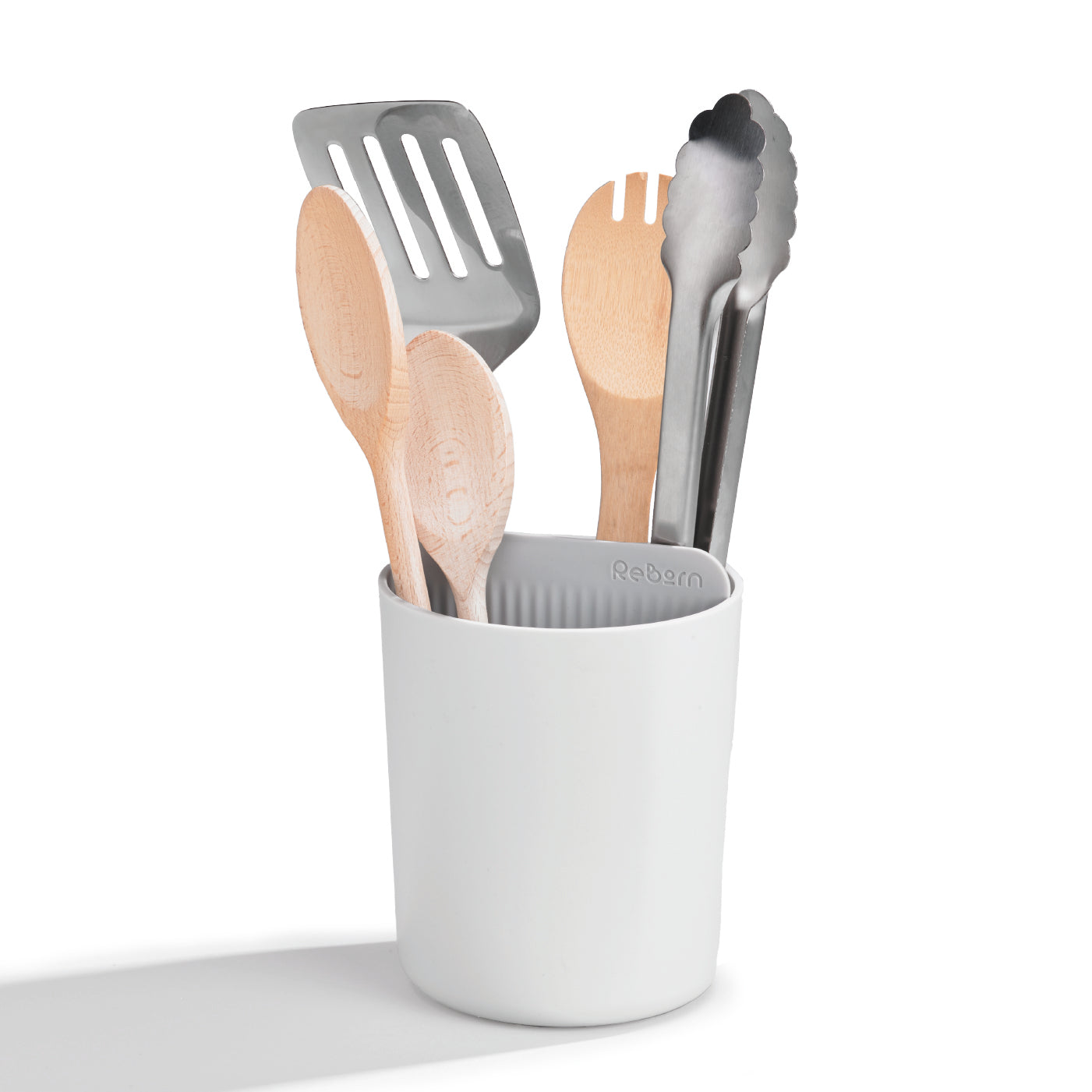 White recycled utensil holder keeps kitchen tools organized while supporting sustainable living.