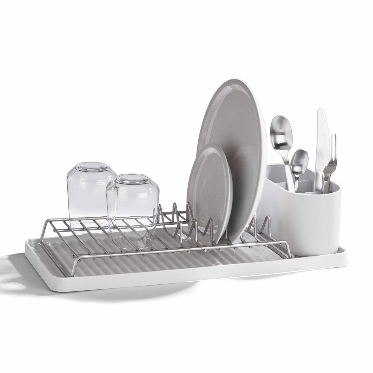 Compact recycled draining rack with water-catching tray and utensil holder for clutter-free kitchens.