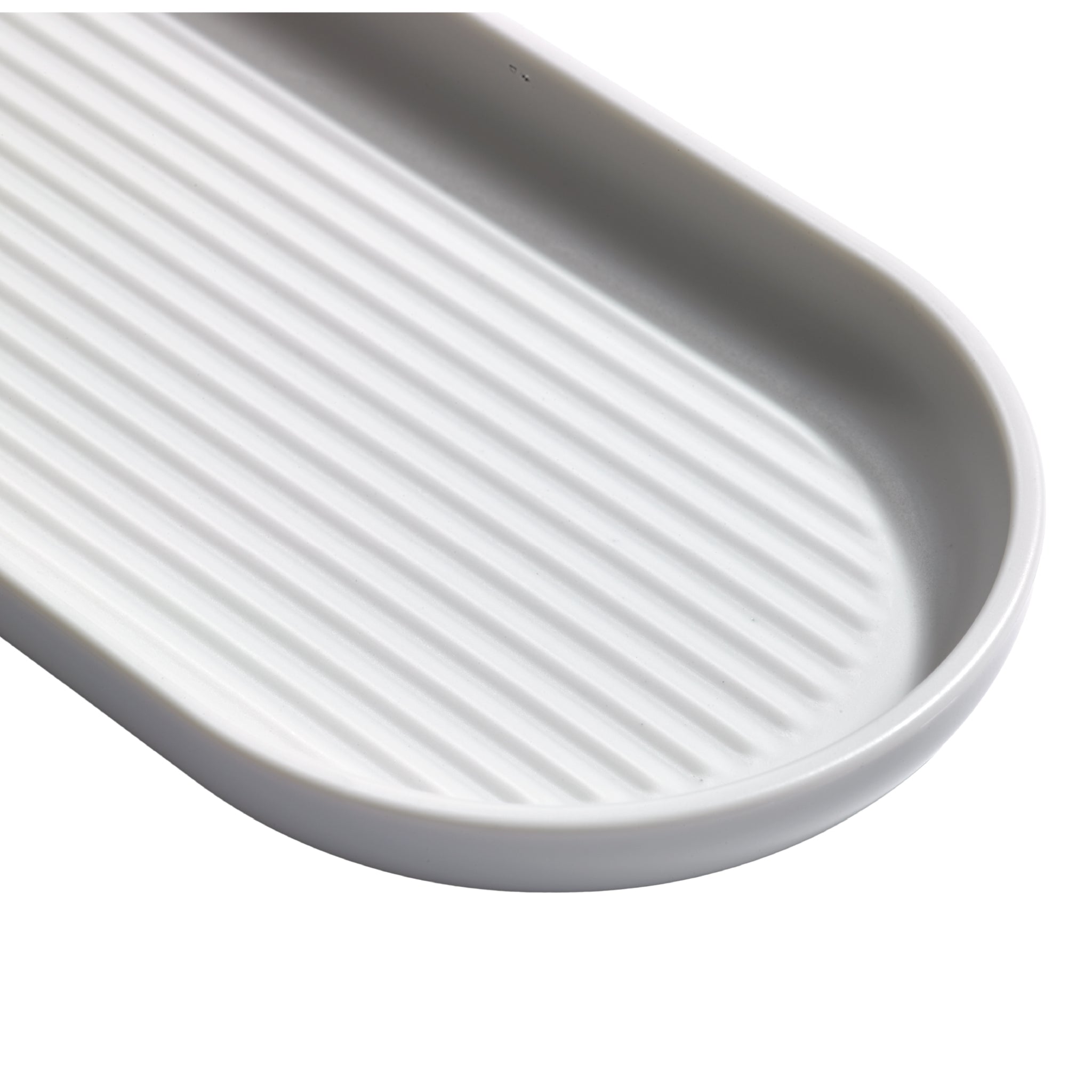 Light grey ribbed bathroom tray with non-slip design, perfect for organizing essentials stylishly.