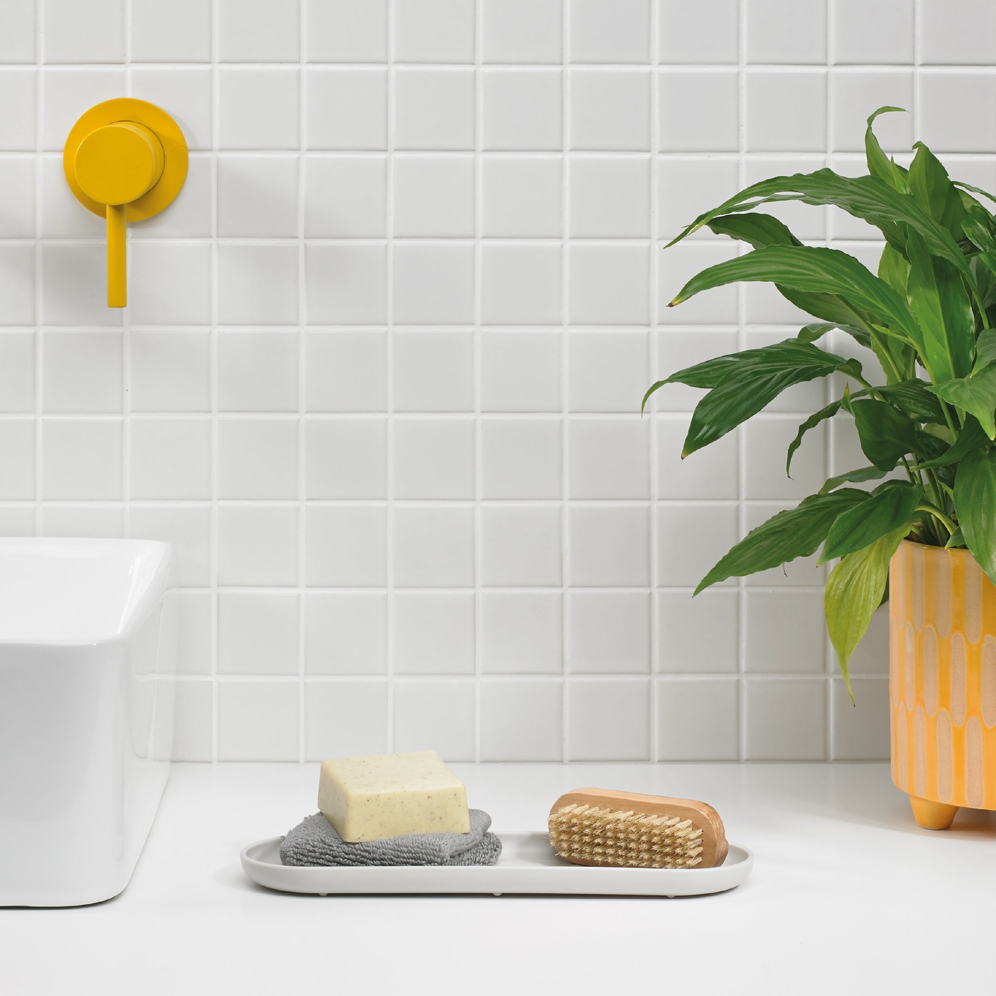 White minimalist bathroom tray by ReBorn, perfect for organizing soaps, brushes, and essentials stylishly.