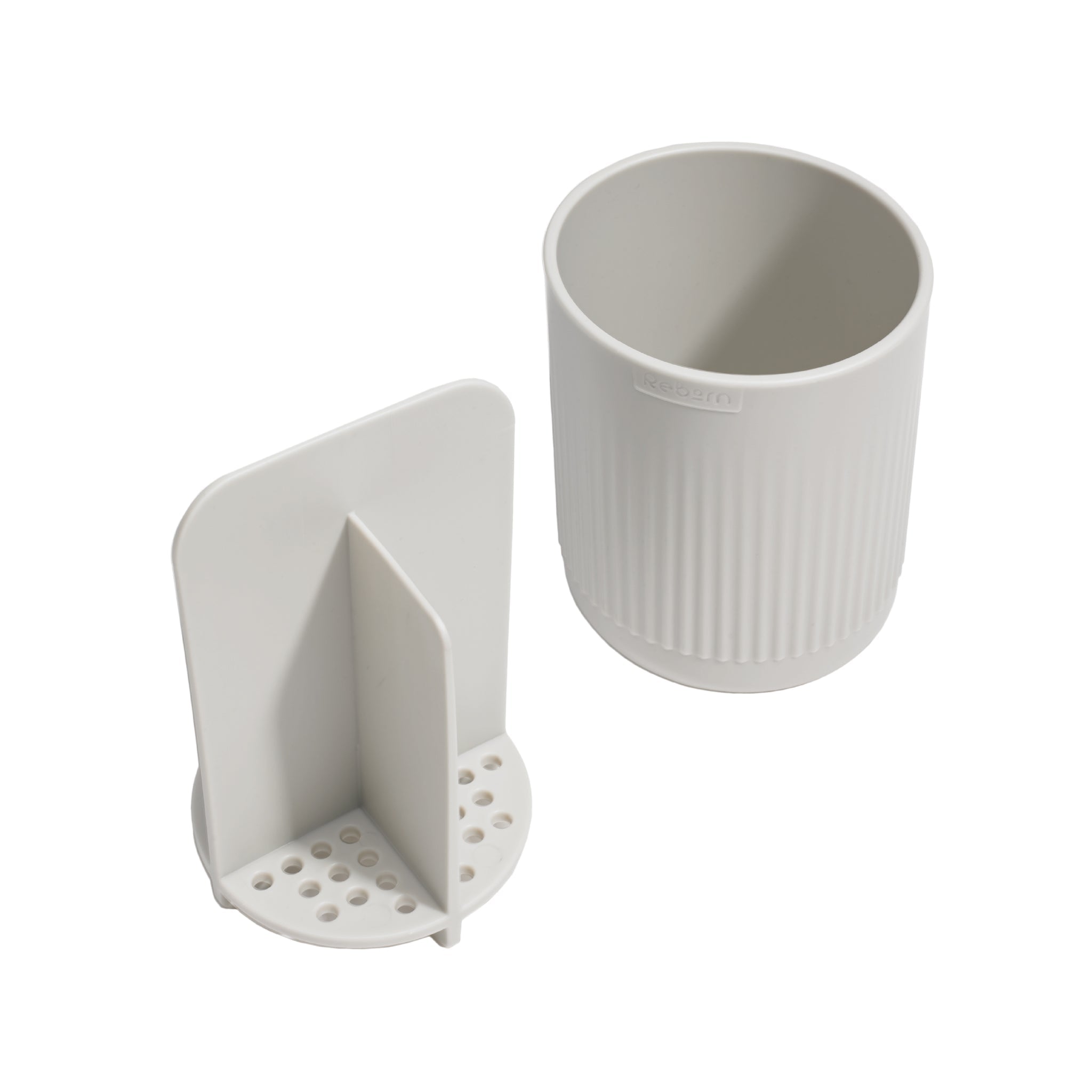 ReBorn toothbrush holder with ventilated insert for hygienic drying and organized storage.