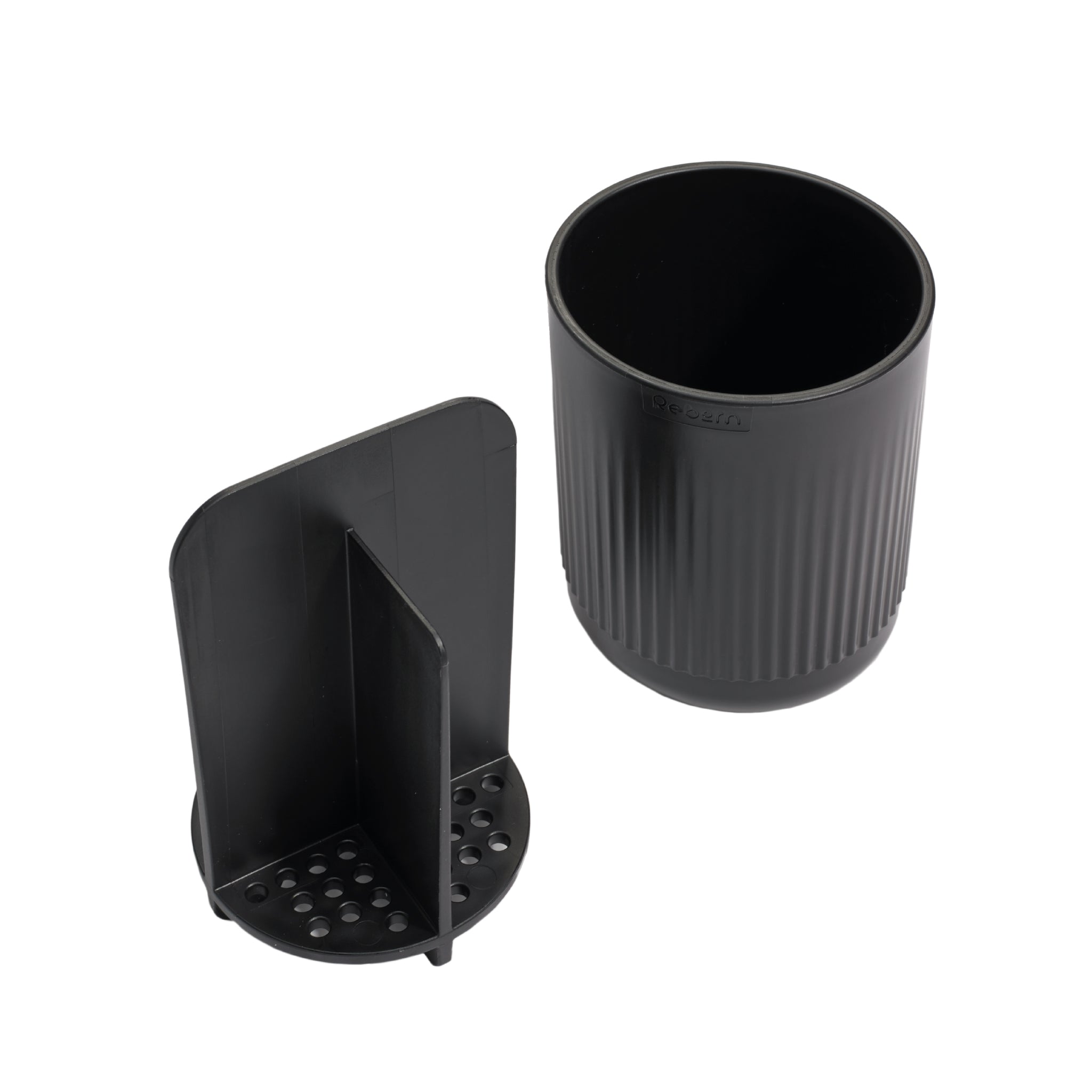 Black toothbrush holder with dividers and drainage holes for organized, hygienic storage.