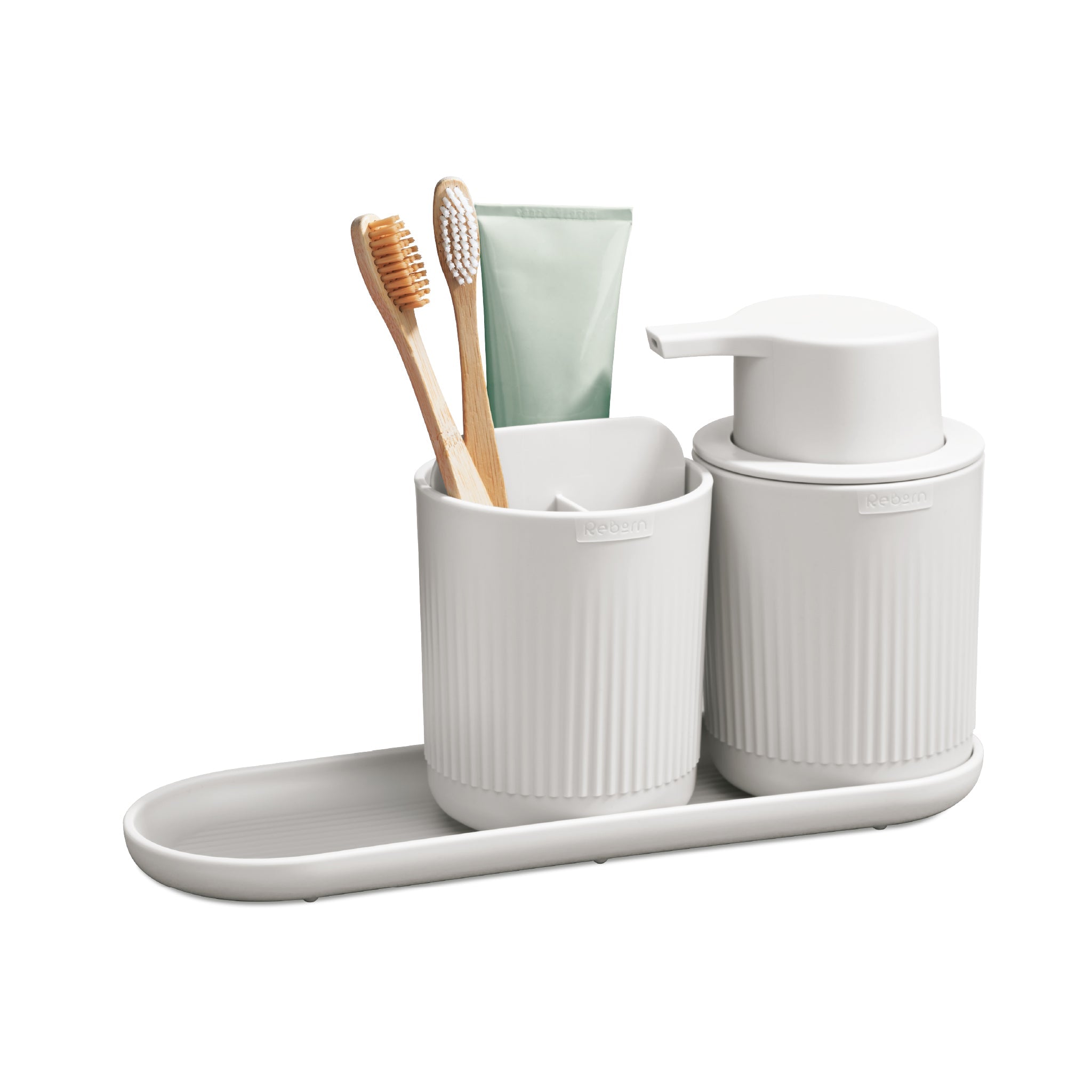 Minimalist bathroom set with ribbed texture, includes soap dispenser, toothbrush holder, and tray.