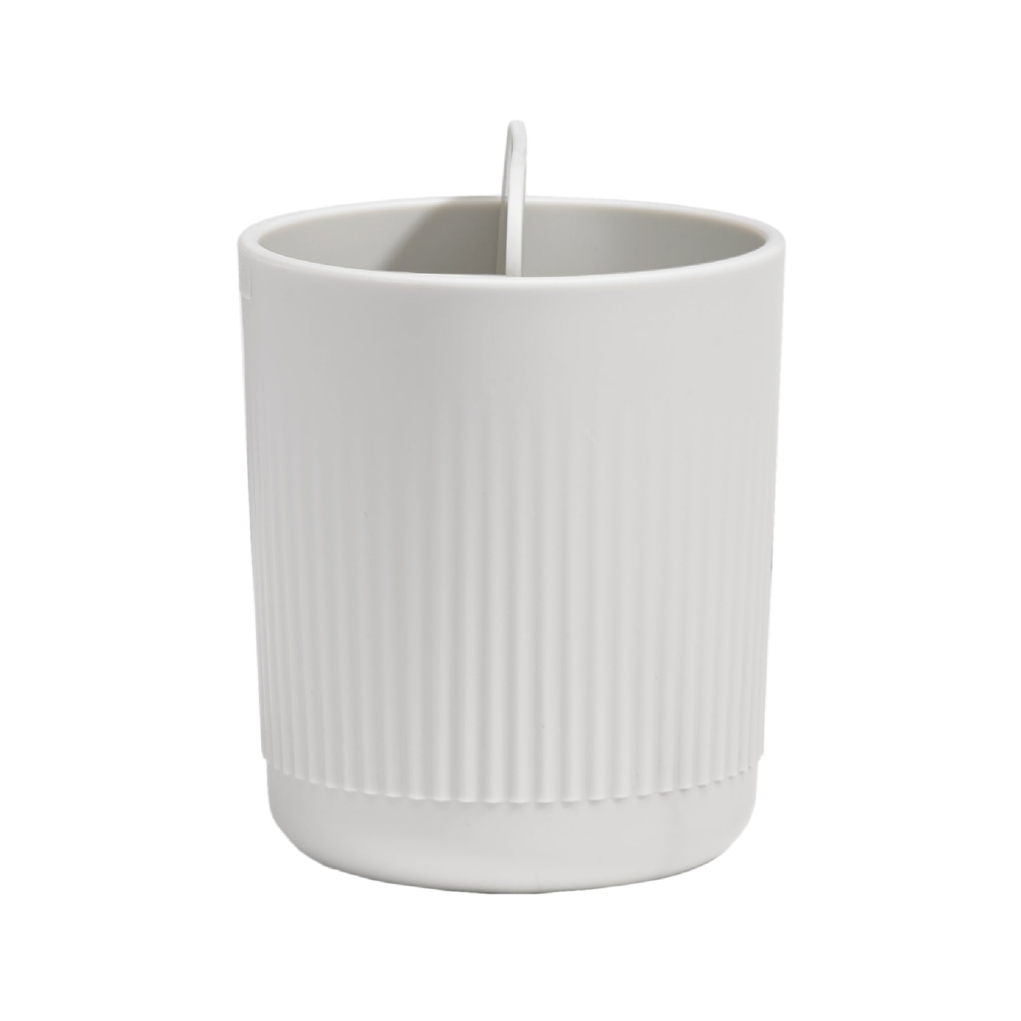 Minimalist ribbed toothbrush holder with built-in divider for organized, modern bathroom storage.