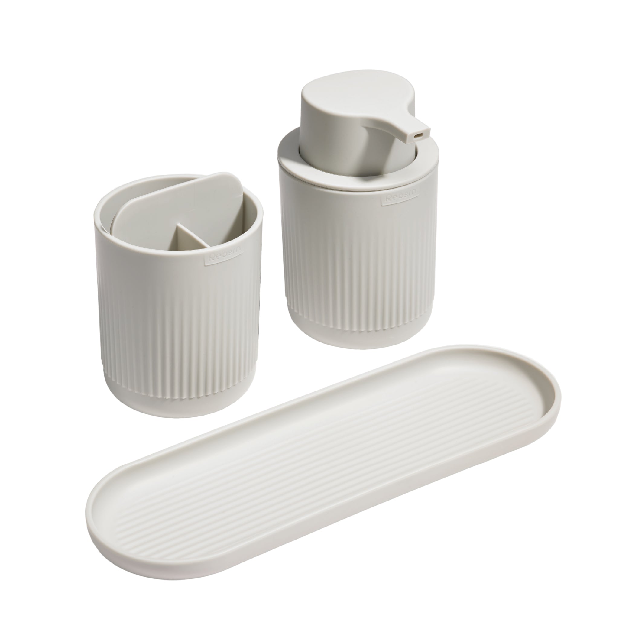 Minimalist ribbed bathroom set with soap dispenser, toothbrush holder, and tray for organized countertops.