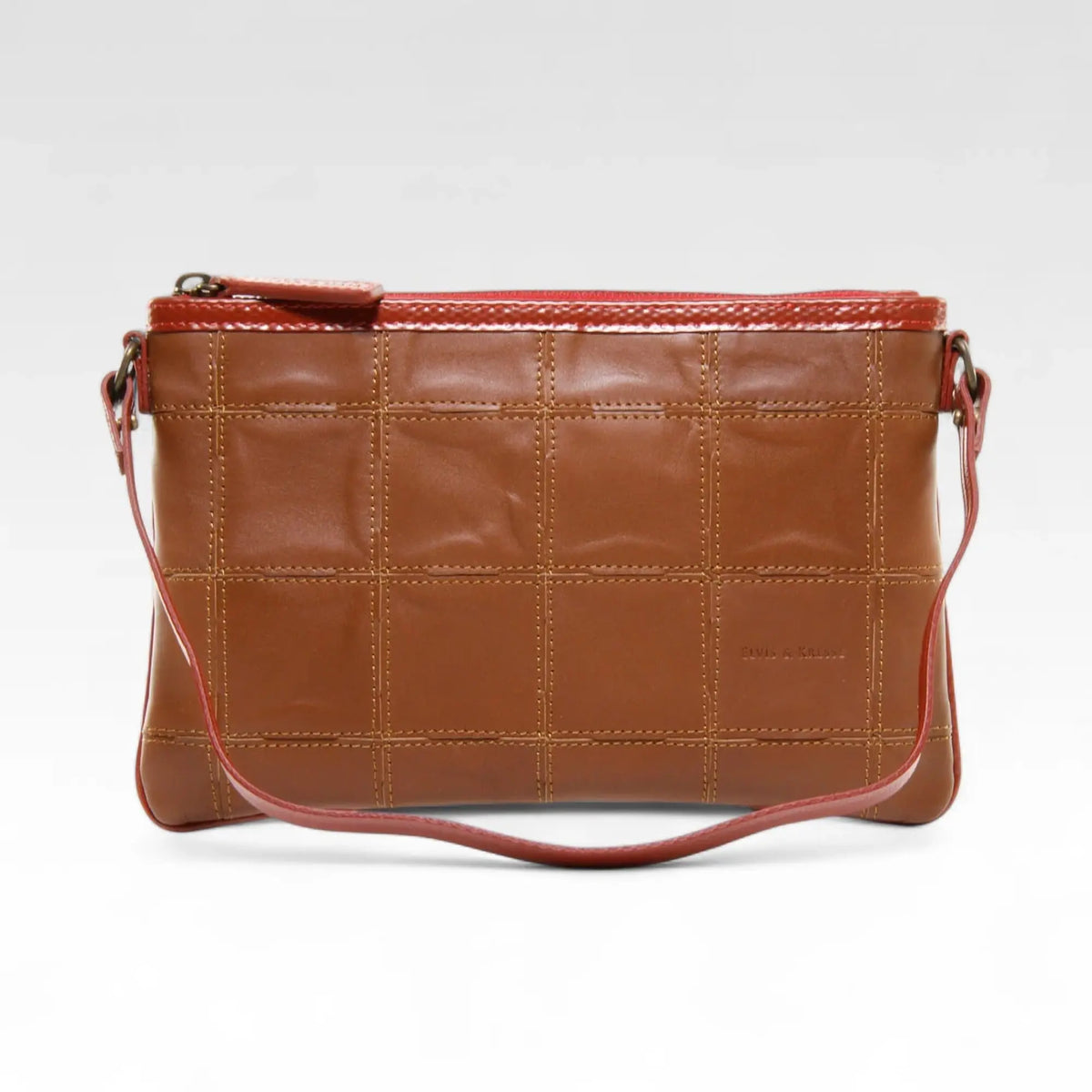 Elvis & Kresse clutch bag in cognac rescued leather with fire-hose