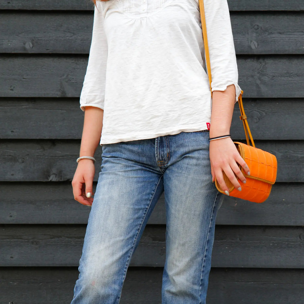 Elvis & Kresse crossbody bag worn across the body, lifestyle