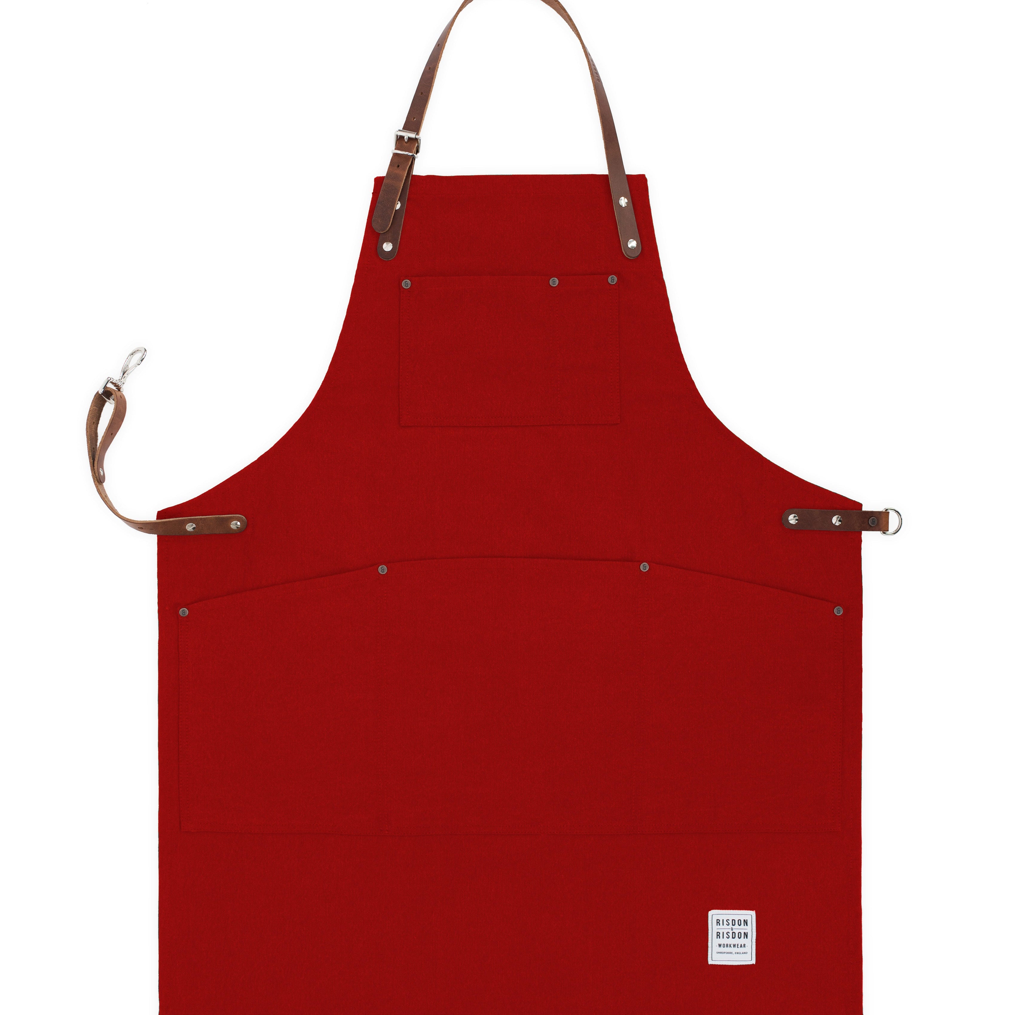 Handcrafted, factory red canvas apron; made in Britain with pockets and removable leather straps.