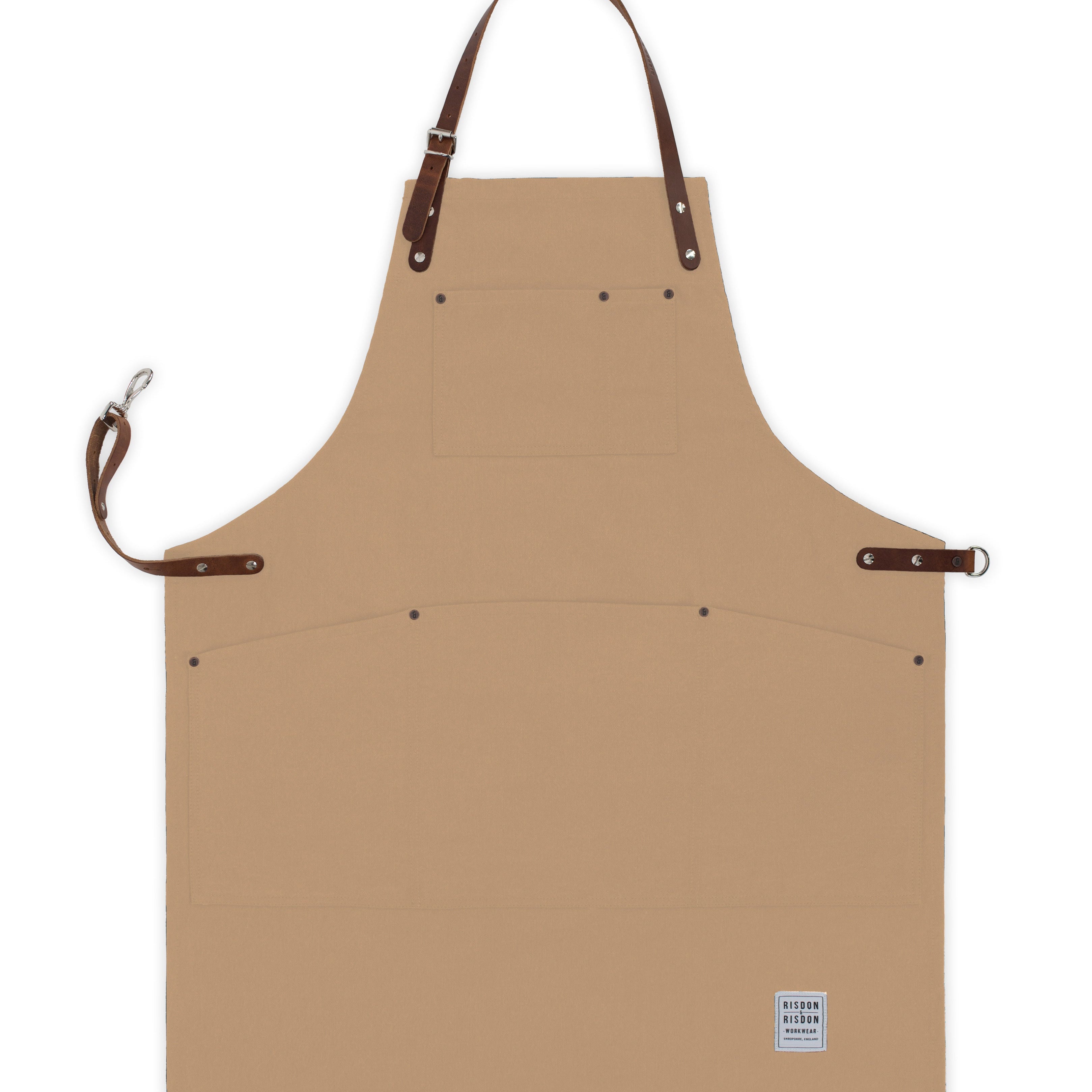 Handcrafted, trade brown canvas apron; made in Britain with pockets and removable leather straps.