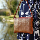 Elvis & Kresse leather and fire-hose clutch bag, lifestyle