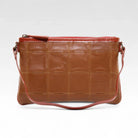 Elvis & Kresse clutch bag in cognac rescued leather with fire-hose