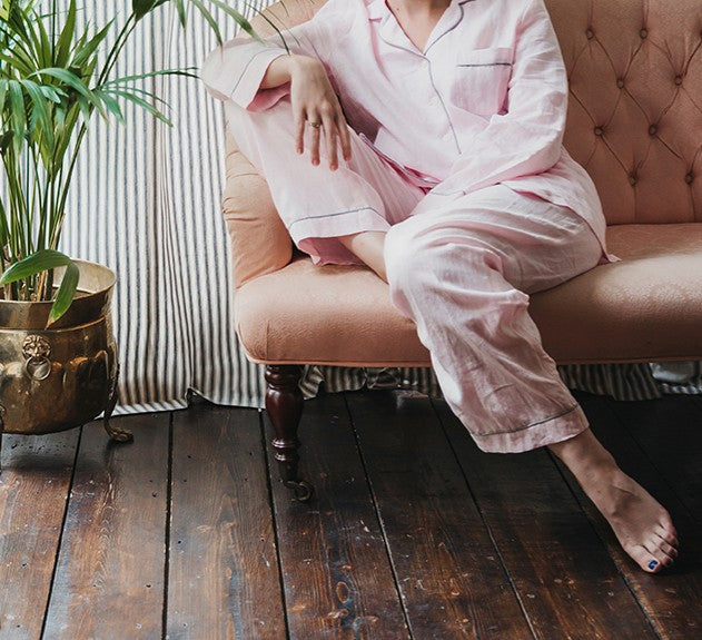 Woman wearing blush pink linen pyjamas set